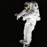 nasa Astronaut in protective white suit in space at black background