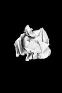 crumpled white paper on black background