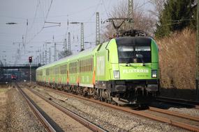 electric passenger Train on Railway at fall