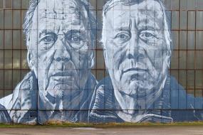 Graffiti of the portraits of the buddy workers, in Ferropolis, Germany