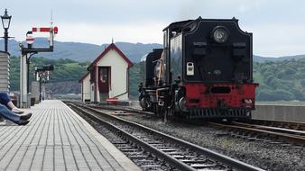 landscape of Steam Train on a station and mountains