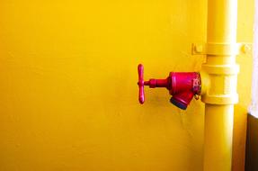 Red valve on yellow Pipe