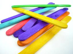 multicolored ice cream sticks on white background