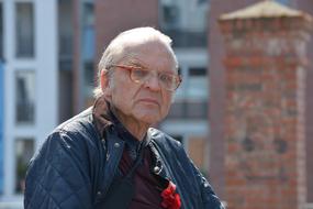 thoughtful senior man in glasses