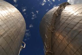 steel industrial tanks and sky