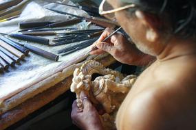 master makes wooden figures
