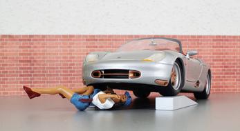 mechanic model under Porsche car