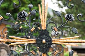 Wrought Iron Rose on Cross on cemetery