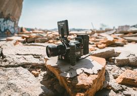 optical photo camera on a rock outdoors
