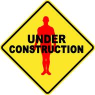 under construction road sign with male silhouette