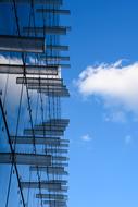 Dynamic shutters on glass facade