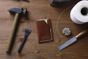 Tools, notebook and paper on the wooden table