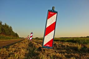 red-white striped safety posts