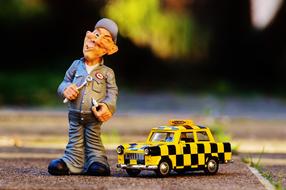 figures of auto mechanic and taxi
