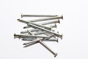 photo of metal nails on a white background