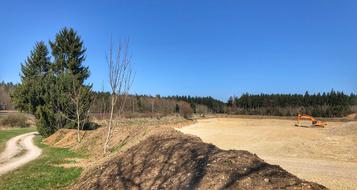 Landscape of construction equipment in countryside