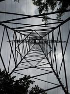 evening photo of the structure of a steel high voltage tower