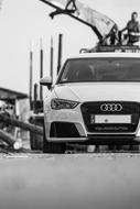 Black and white photo of the white Audi car