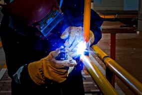 welder at work in factory