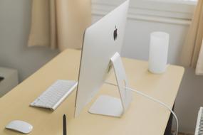 apple firm computer on the table in the office