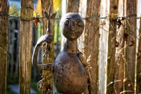 cast iron figure of a woman in the garden