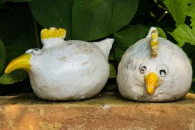 clay hens as decoration in the park