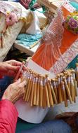 woman weaves lace