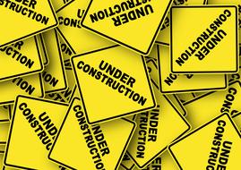 under construction, pile of yellow road signs, drawing