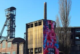 industrial building with graffiti on the wall