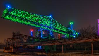 Beautiful bridge with bright, green and blue lights, in Lapadu, Duisburg, Germany