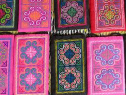 green and pink embroidery on silk fabric