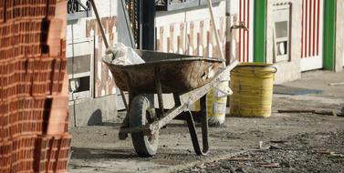 wheelbarrow and bricks at a construction site in finland