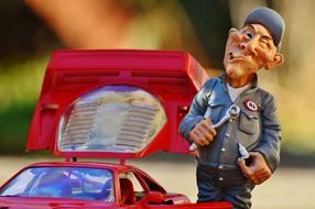 Ferrari Racing Car Mechanic close-up on blurred background