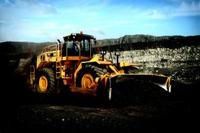 bulldozer while loading at a construction site