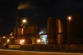 Factory with colorful lights at night
