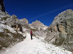a tourist climbs up the mountains