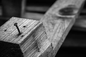 Black and white photo of the wooden palette with a nail