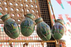 Colorful, beautiful and patterned, traditional pottery for sale on the market