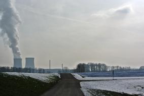 Nuclear Power Plant Cooling Tower in a winter landscape