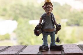 building worker figurine on bricks