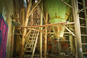 stairs and equipment in an abandoned factory