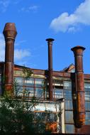 old factory with pipes on a sunny day