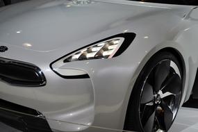 Beautiful, shiny KIA sports car with headlights