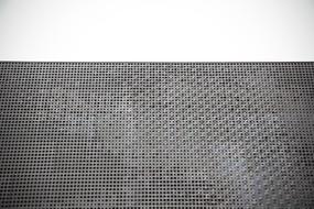 metal mesh on the wall of the building