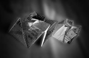 figurines with newspaper on a blurred background