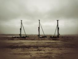 industrial machines on a construction site against a rainy sky background