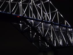 Beautiful Tokyo Gate Bridge with colorful lights, among the darkness, at night, in Japan