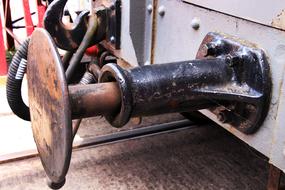 Close-up of the rusty metal train bumper, of the train, on the railroad