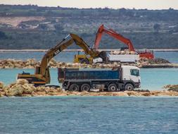 excavators next to a truck in cyprus