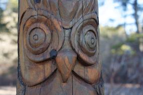 carved wood sculpture close up on blurred background